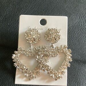 Cute Earrings, Silvertone color, not very heavy.